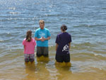 Geoff prays over the girls.