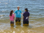 Geoff prays over the girls.