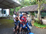 Manoa taking a ride on a motorcycle